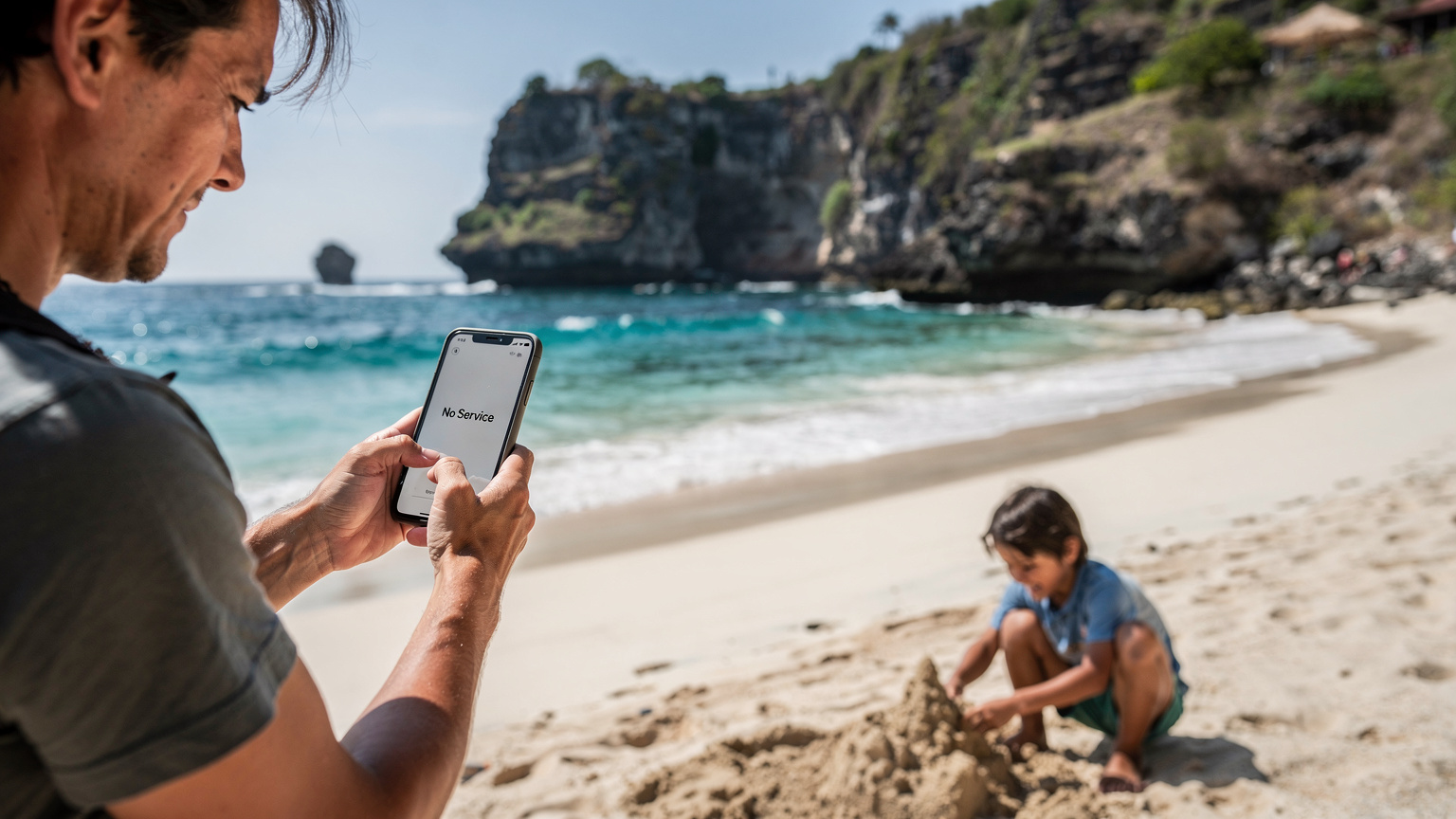 A parent with a worried expression, holding a smartphone showing 'No Service' while standing on a small, slightly remote beach in Nusa Penida, with a child playing in the sand nearby.