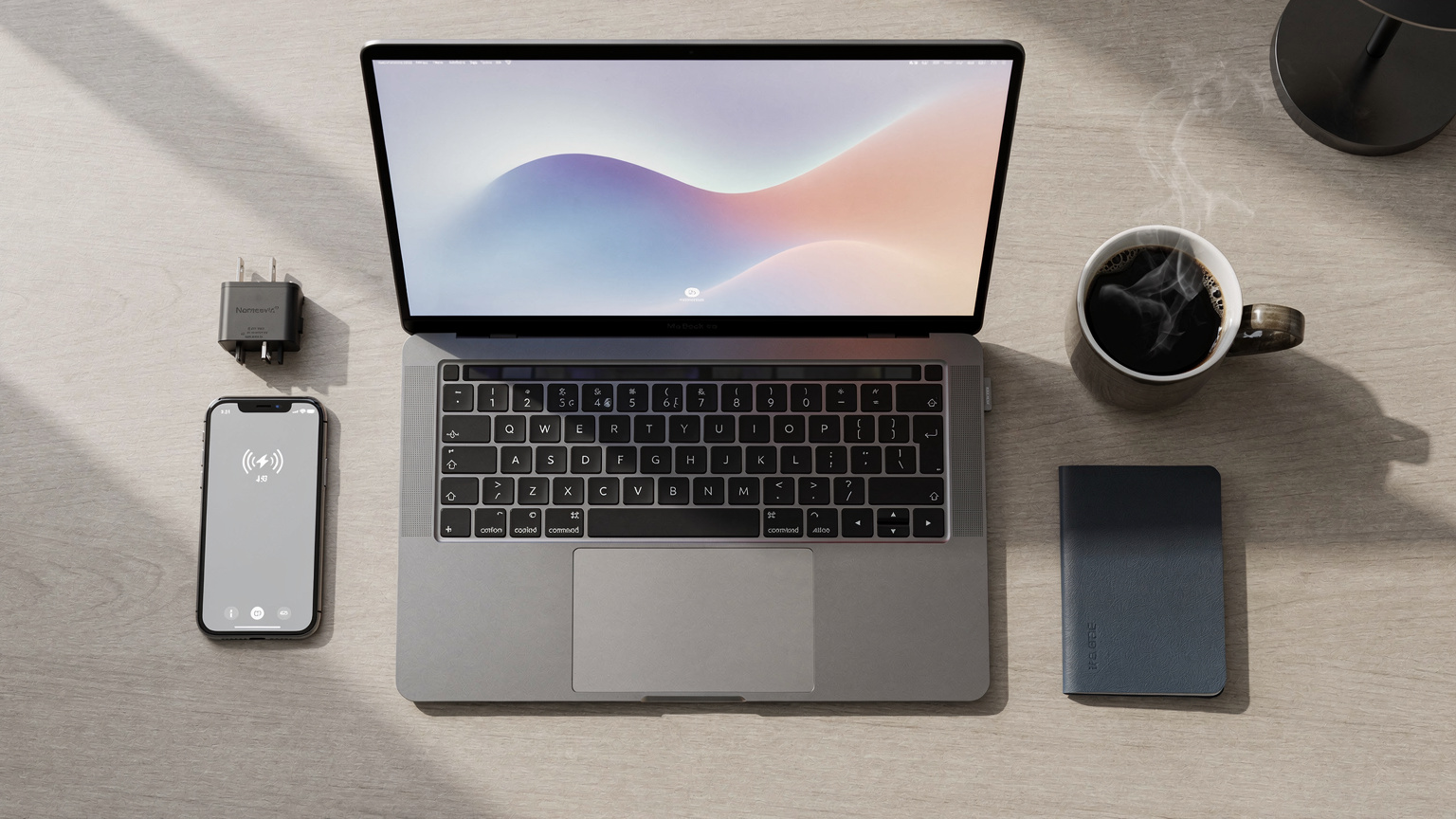An overhead shot of a business traveler's desk setup in a hotel room, featuring a laptop, smartphone with an eSIM activated, a travel adapter, and a cup of coffee, symbolizing remote work connectivity.