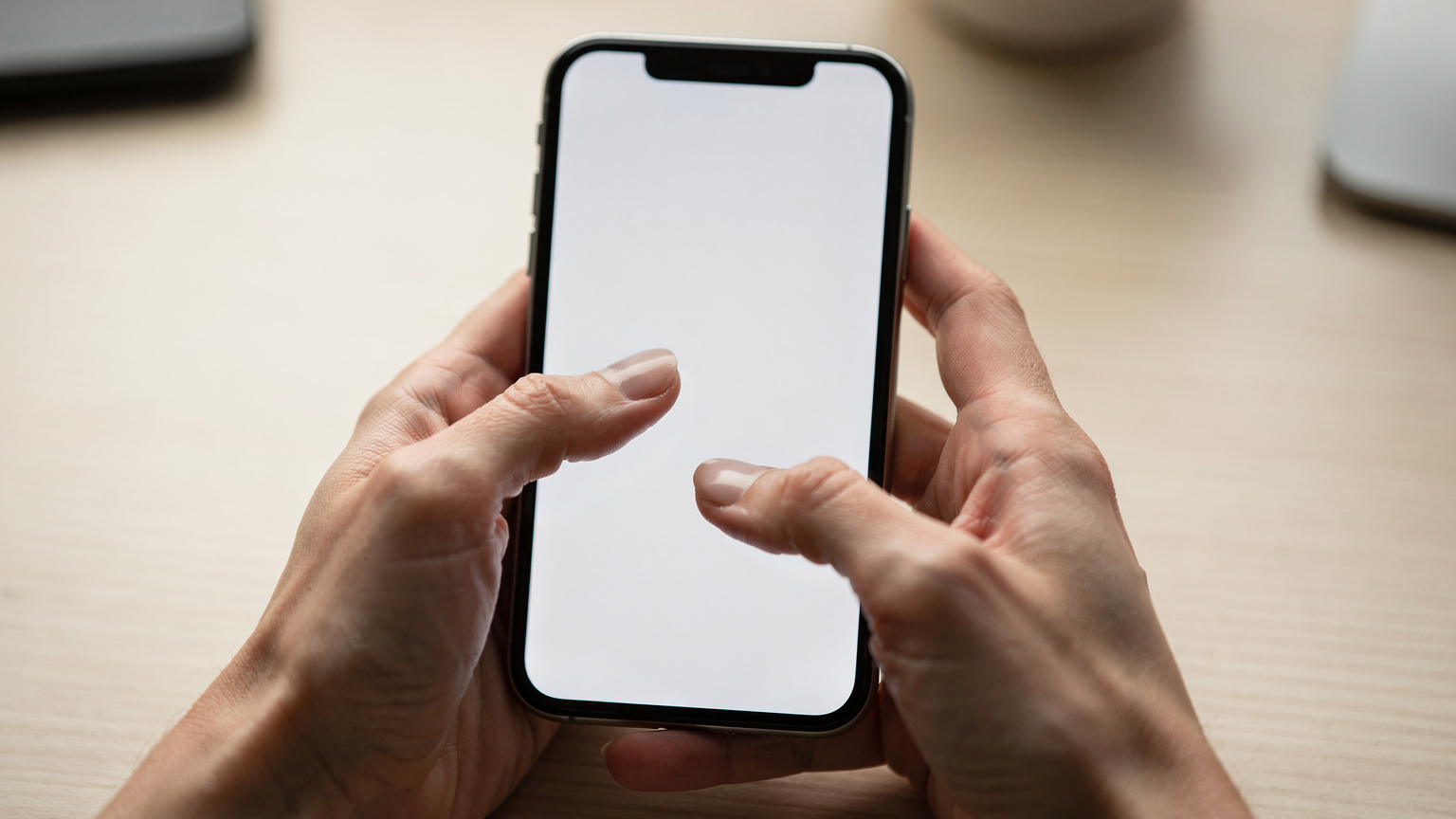 A close-up shot of hands holding a smartphone, with fingers delicately tapping on the screen to add a new eSIM plan in the settings interface, emphasizing user interaction.